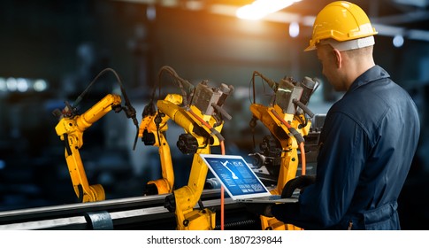 Smart industry robot arms for digital factory production technology showing automation manufacturing process of the Industry 4.0 or 4th industrial revolution and IOT software to control operation . - Shutterstock ID 1807239844
