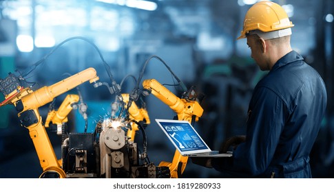 Smart Industry Robot Arms For Digital Factory Production Technology Showing Automation Manufacturing Process Of The Industry 4.0 Or 4th Industrial Revolution And IOT Software To Control Operation .