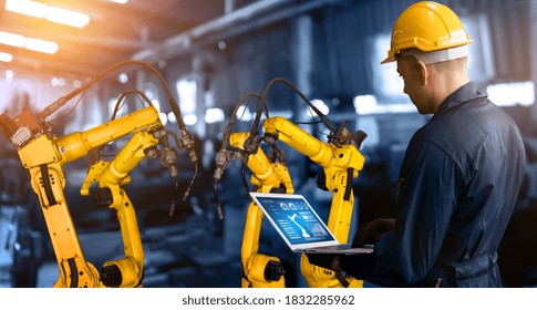 Smart Industry Robot Arms For Digital Factory Production Technology Showing Automation Manufacturing Process Of The Industry 4.0 Or 4th Industrial Revolution And IOT Software To Control Operation .