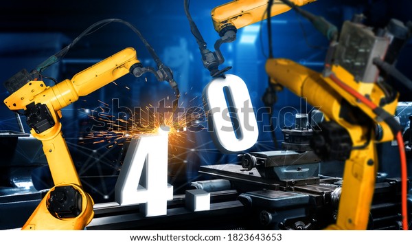 Smart industry robot arms for digital factory
production technology showing automation manufacturing process of
the Industry 4.0 or 4th industrial revolution and IOT software to
control operation .
