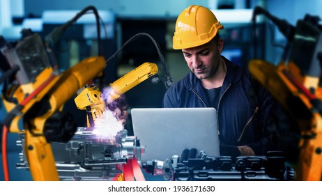 Smart industry robot arms modernization for digital factory technology . Concept of automation manufacturing process of Industry 4.0 or 4th industrial revolution and IOT software control operation . - Shutterstock ID 1936171630