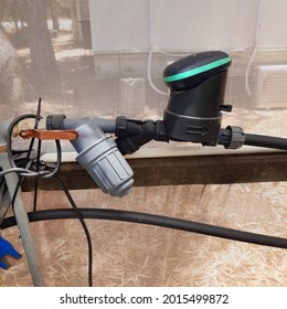 Smart Irrigation Sprinkler Controller With Water Meter And Measuring Device Connecting To The Water Ball Valve In The Greenhouse 