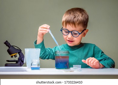 Smart Little Scientist Doing Experiments. Education Concept. Child Doing Chemical Research At Home Laboratory. Dangerous Experiment. Home Activities For Children. Preschooler Interests. Online Courses