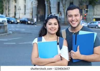 Smart looking couple of ethnic students - Shutterstock ID 1234063657