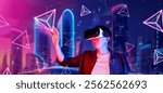 Smart man wearing VR glasses while excited about exploring in metaverse. Asian gamer looking at geometric shape or futuristic city with glowing neon color of purple and blue. Technology. Ingenuity.