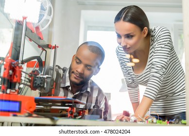 Smart Man And Woman Watching 3d Printing