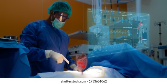 smart medical technology concept, doctor use glasses to use augmented reality to show the injury of stomach of the patient for analysis and find the way to treatment in surgery room at hospital - Powered by Shutterstock