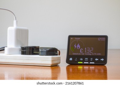 Smart meter placed and a electrical extension cord with connected plug - Shutterstock ID 2161207861