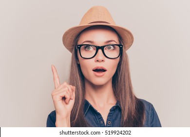 Smart Minded Woman With Raised Finger Having An Idea