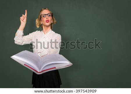 Smart nerd teacher substitute lecturing class with text book in classroom space for print