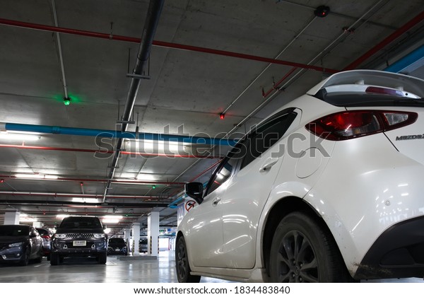 Smart parking\
guidance in department store with light overhead. Car-side : 13\
October 2020 - Bangkok,\
Thailand.