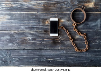 Smart phone addiction concept. Smartohone with chain  and collar