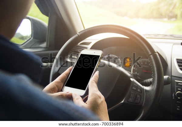 Smart phone in car It\'s arranged to put your\
pictures and information.road trip, travel, destination technology\
and people concept.