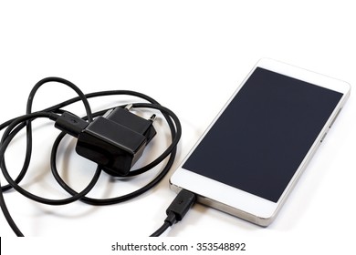 Smart Phone And Charger Isolated On White