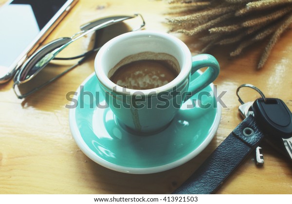 Smart phone with coffee
cup and key car