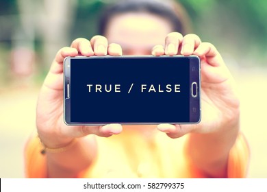 smart phone display true or false on screen - Shutterstock ID 582799375