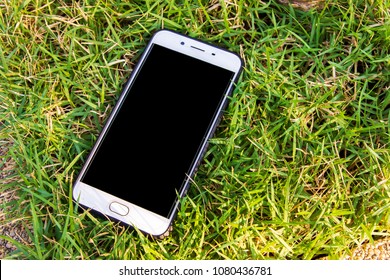 Smart Phone In The Grass. Lost Phone