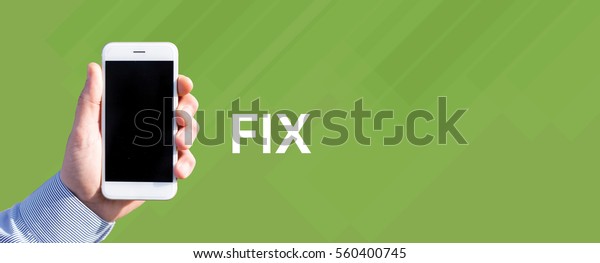 Smart phone in hand front of green background and\
written FIX