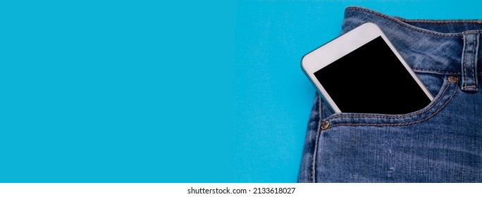 smart phone inside jeans pocket with copy space