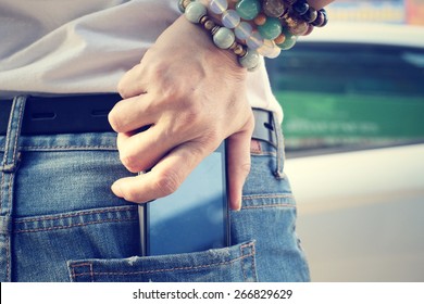 Smart phone in jeans pocket