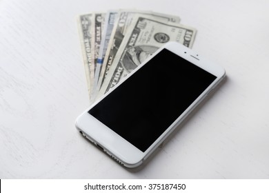 Smart Phone On Dollar Banknotes Over Stock Photo 375187450 | Shutterstock