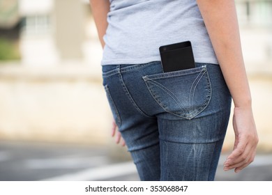 Smart Phone In Pocket Of Girl's Jeans