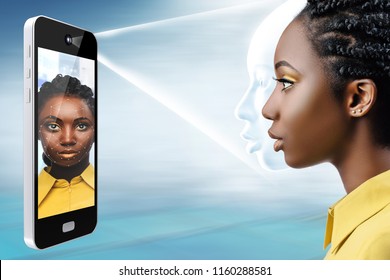 Smart Phone Projecting Light Bean On African Female Face.Side View Of Conceptual Face Recognition Technology.
