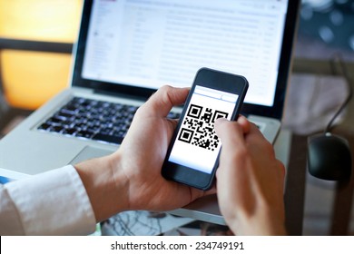smart phone with qr code on the screen