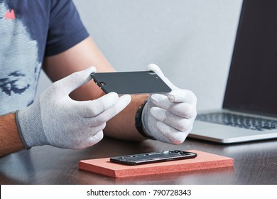 Smart Phone Repair. Repairman Hands With Screen