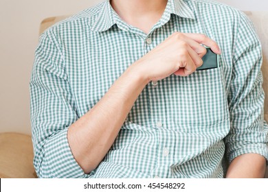 Smart Phone In Shirt Pocket Of A Business Man, Technology Background Concept