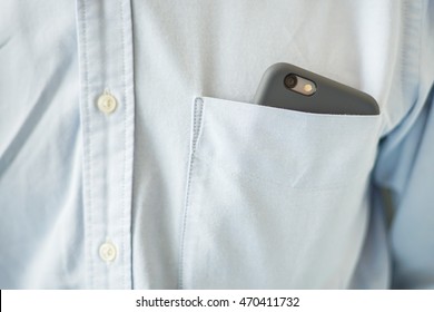 Smart Phone In Shirt Pocket Of A Business Man, Technology Background Concept