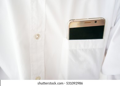 Smart Phone In Shirt Pocket Of A Business Man, Technology Smartphone Background Concept