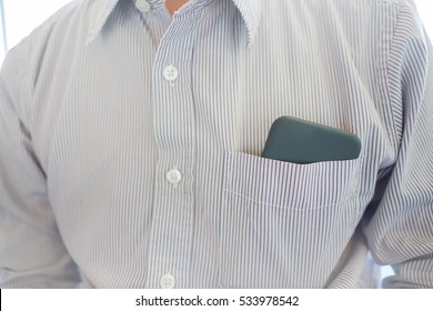 Smart Phone In Shirt Pocket Of A Business Man, Technology Smartphone Background Concept