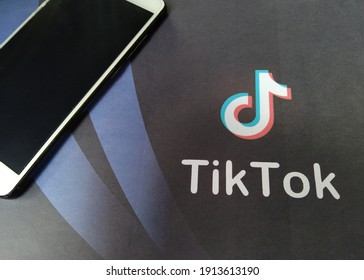 Smart Phone With TIK TOK Logo, The Illustrative Popular Social Network On The Internet. New York, USA. Wednesday February 10, 2021