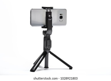 Smart Phone And Tripod Isolated On White Background