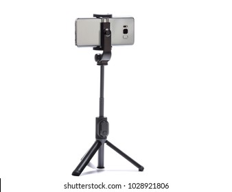 smart phone and tripod isolated on white background