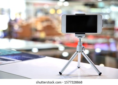 Smart Phone And Tripod Set On The Table/mobile Phone
