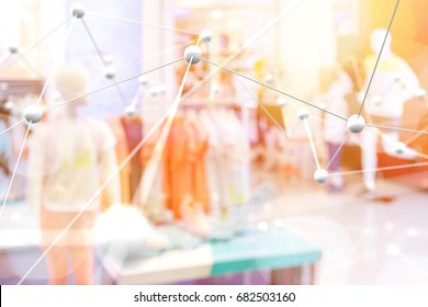 Smart retail , deep learning , neural networks technology and marketing concept. Artificial intelligence atoms connect with retail fashion shop store background. Warm tone with flare light effect.