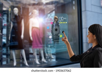 Smart Retail, Shopping Online Technology Concept, Woman Try To Use Smart Display With Virtual Or Augmented Reality In The Shop Or Retail To Choose Select ,buy Cloths And Give A Rating Of Products 
