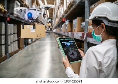 Smart retail warehouse concept.Engineer control drone for delivering mechanical shipping product to customer.Smart warehouse with artificial intelligence,blockchain,quantum computer,5G,AR technology - Powered by Shutterstock