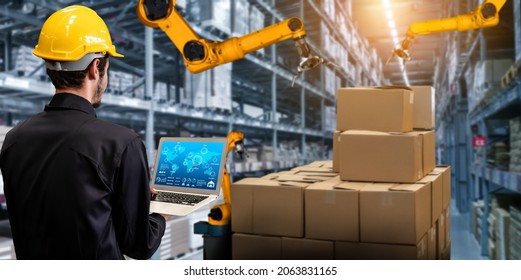 Smart robot arm systems for innovative warehouse and factory digital technology . Automation manufacturing robot controlled by industry engineering using IOT software connected to internet network . - Shutterstock ID 2063831165