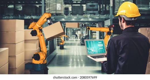 Smart robot arm systems for innovative warehouse and factory digital technology . Automation manufacturing robot controlled by industry engineering using IOT software connected to internet network . - Shutterstock ID 2080597699