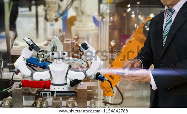 smart\
robot replacement Industrial 4.0 of things technology robot future\
arm and man using controller for control\
electronic
