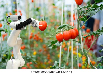 smart robotic farmers in agriculture futuristic robot automation to work to spray chemical fertilizer or increase efficiency - Shutterstock ID 1155509476