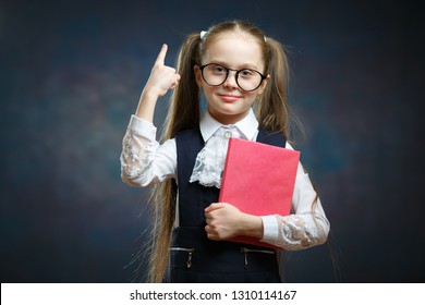 Smart Schoolgirl Hold Book Point Index Finger up