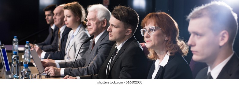 Smart scientists in different age during science conference. The team leader speaking to microphone - Shutterstock ID 516602038