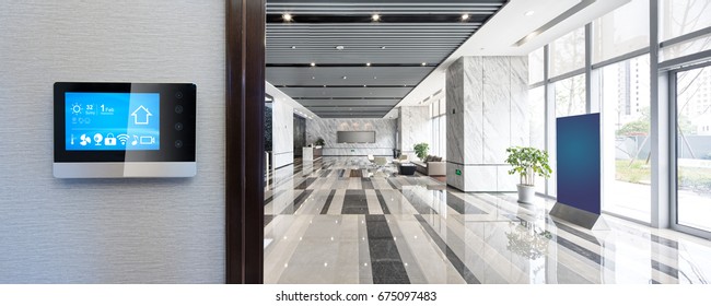 smart screen on wall with spacious hall in modern office building - Shutterstock ID 675097483