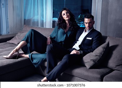 Smart, Serious Couple In A Luxurious Hotel's Apartment