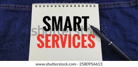 Smart Services on a notebook with a black pen on a denim background: Concept of Digital Solutions for Efficient Business Operations.
