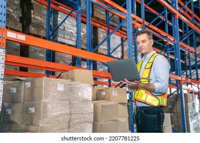 Smart Smiling Caucasian Warehouse Man,worker,manager Use Laptop To Check Goods On Shelf For Product Distribution Stock Management, Logistics Shipping Business Planning Concept With Copy Space